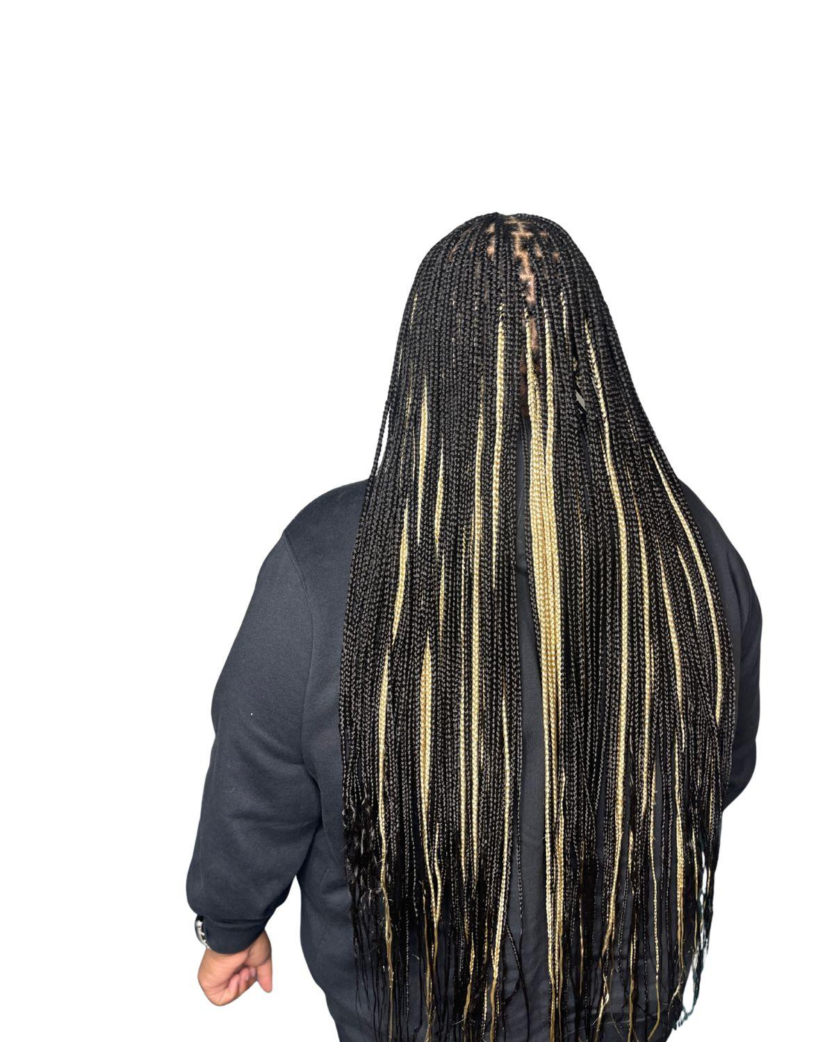 Client wearing neatly finished medium knotless braids