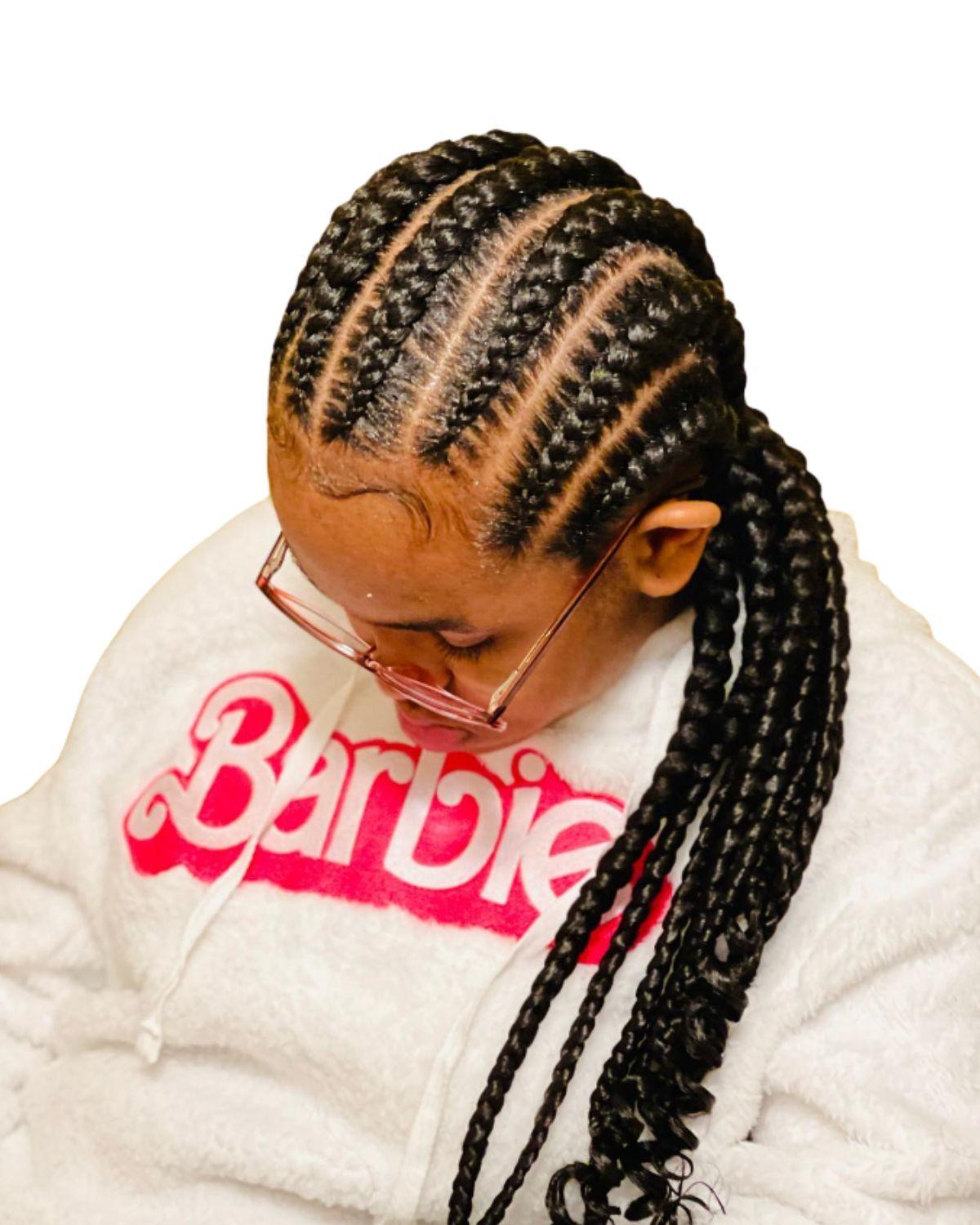 Client wearing sleek stitch braids with precise parting
